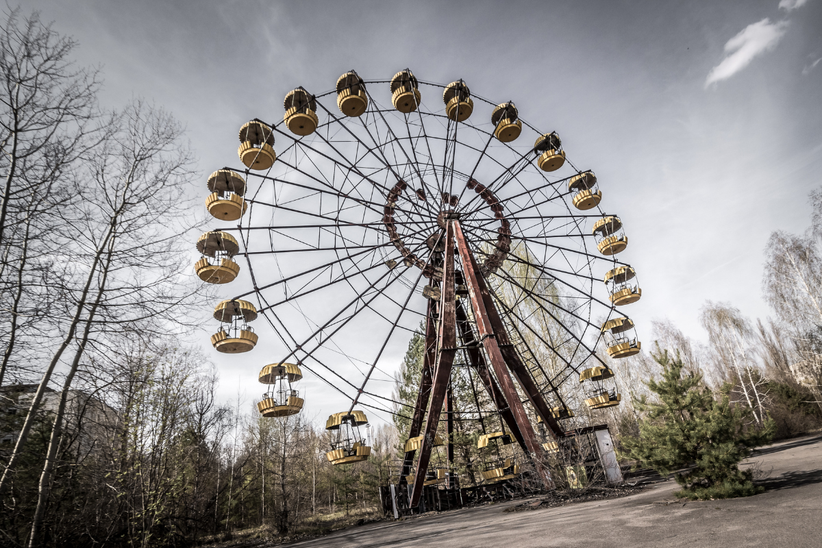 Ferris wheel sits idle in abandoned theme park