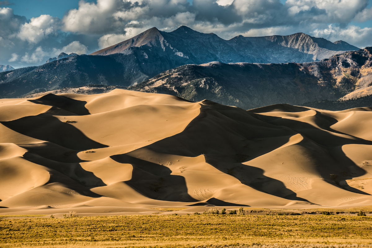 Sun shines on Colorado's Great Sand Dunes National Park.