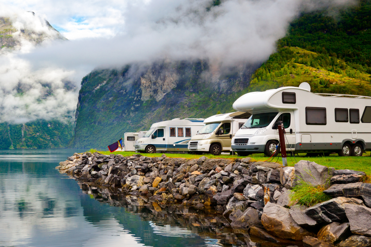 Recreational vehicles parked near the water.