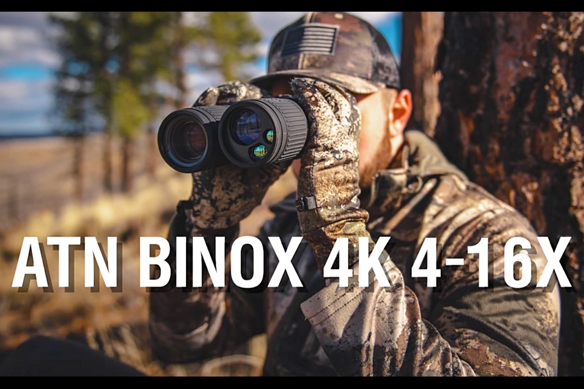 Hunter looks through the ATN BinoX 4K.