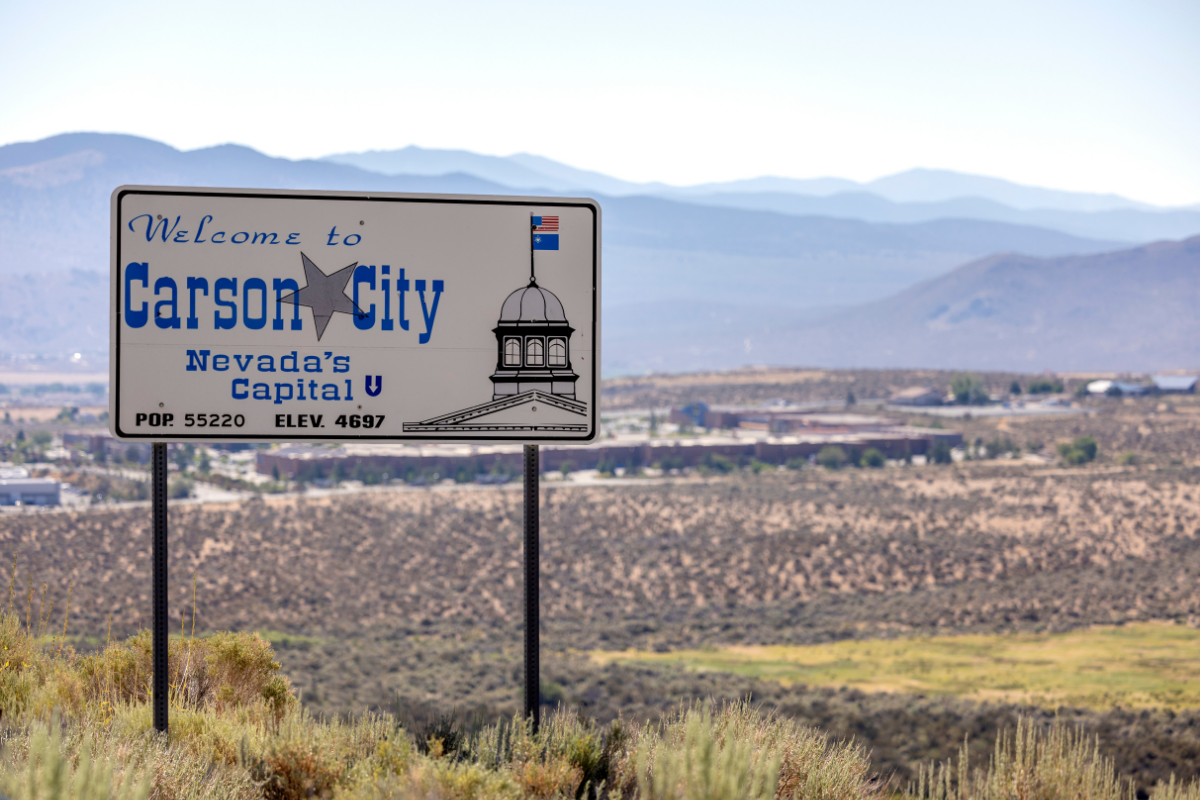 a sign welcoming motorists to Carson City, Nevada.