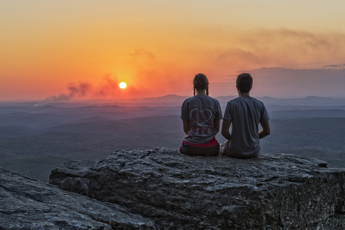 Hikers watch the sunset at Alabama's Cheaha State Park.