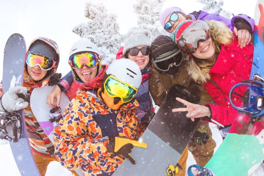 Skiers and snowboarders at a spring skiing party