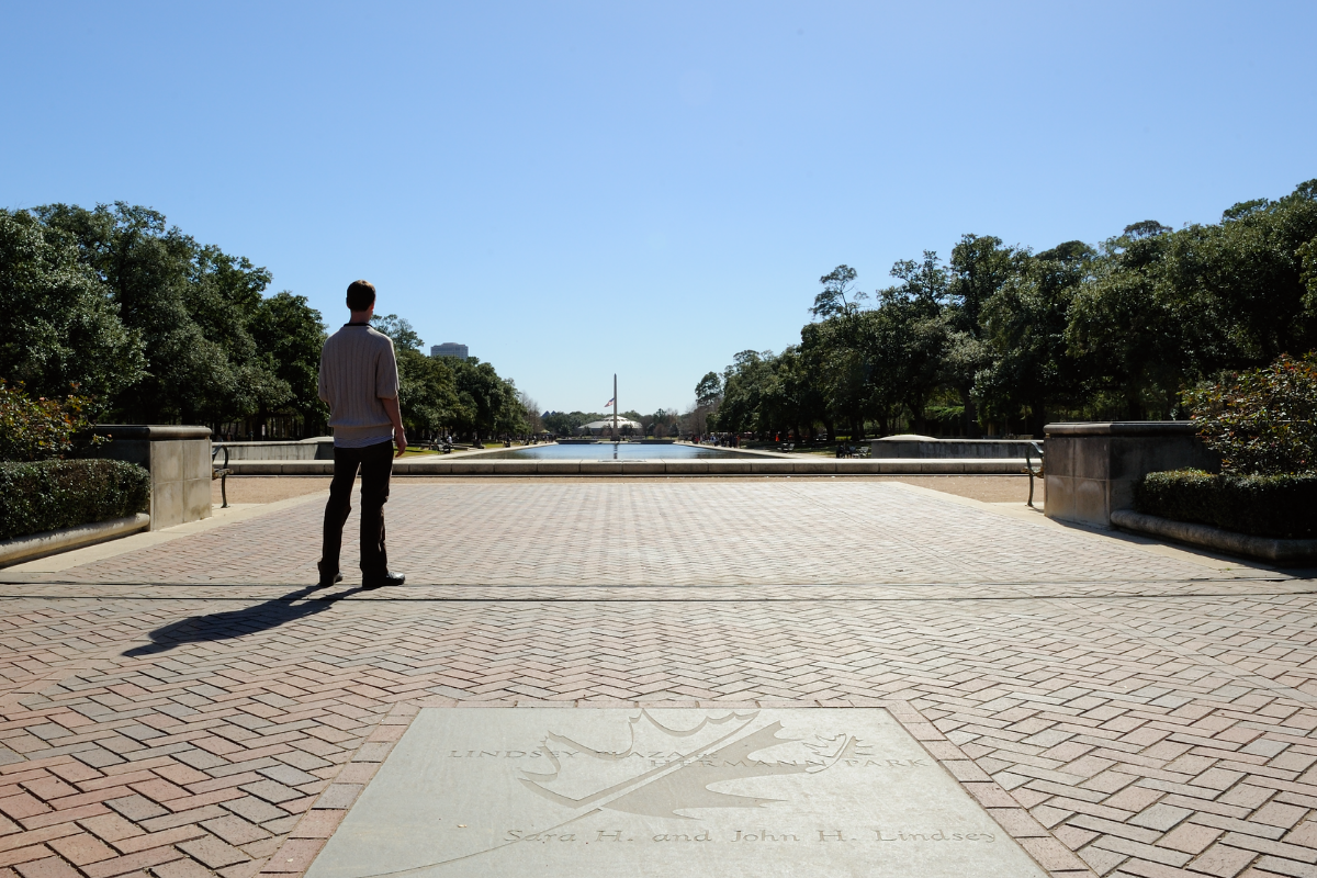 a man stands gazing out at Hermann Park in Houston Texas in January 2014