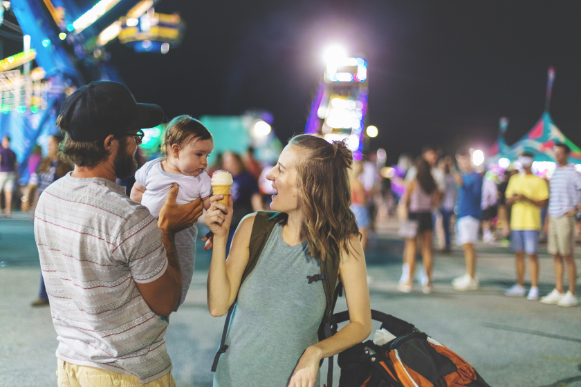 Young Millennial family enjoying their time at the Empire State Fair in Springfield MO on a hot July summer night